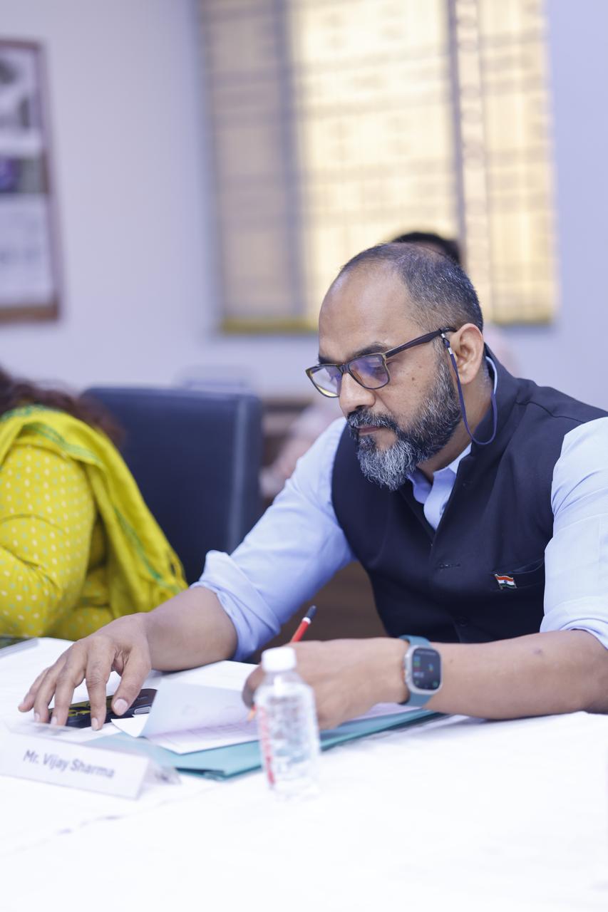 Vijay Sharma in a strategy session at a roundtable